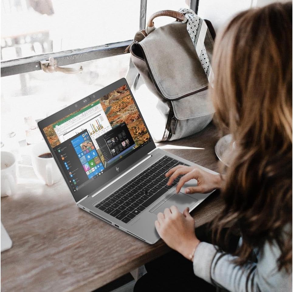 Woman using refurbished HP EliteBook 840 G6 laptop with Intel i5 8th Gen in a workspace setting – available in Hyderabad – Laptomart